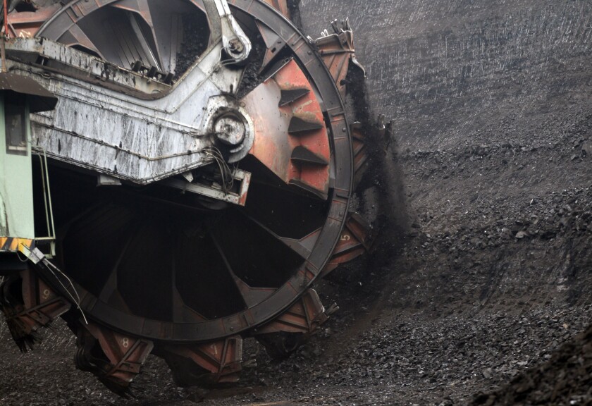 FILE - A huge excavator digs inside a giant open pit lignite mine, near the town of Most, Czech Republic, Nov. 12, 2015. The Czech Republic has decided to reverse previous plans and continue mining in a key black coal region amid high demand to help the country safeguard its power supply amid the Russian war in Ukraine. Finance Minister Zbynek Stanjura said on Thursday, June 30, 2022 the state-owned OKD company will extend its mining activities in north-eastern Czech Republic until at least the end of next year. (AP Photo/Petr David Josek, file)