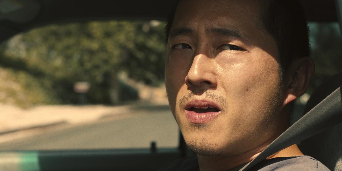 A close-up of an angry man (played by Steven Yeun) in the midst of a road-rage incident in the Netflix limited series "Beef."