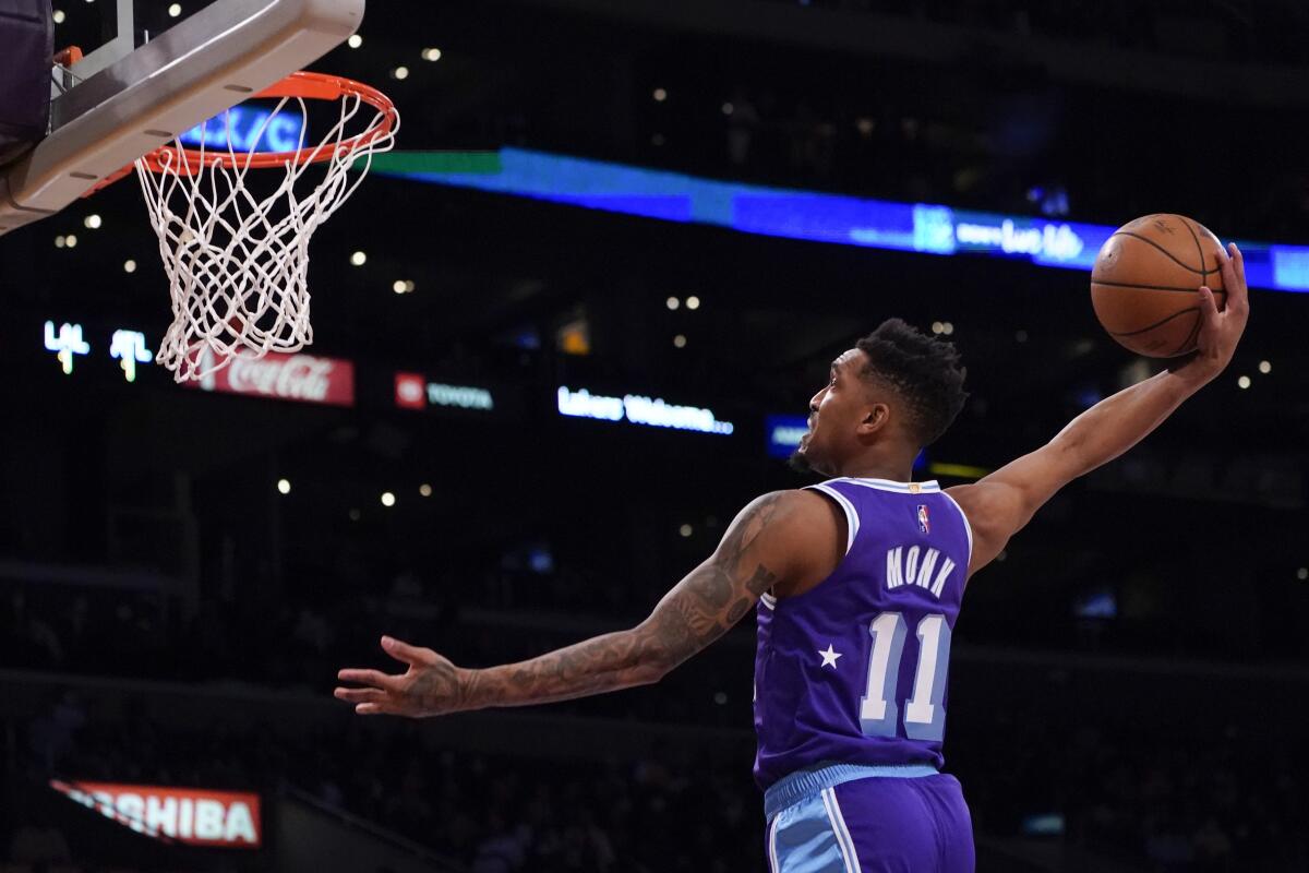 Lakers guard Malik Monk (29 points) dunks during a 134-118 win over the Atlanta Hawks on Friday night.