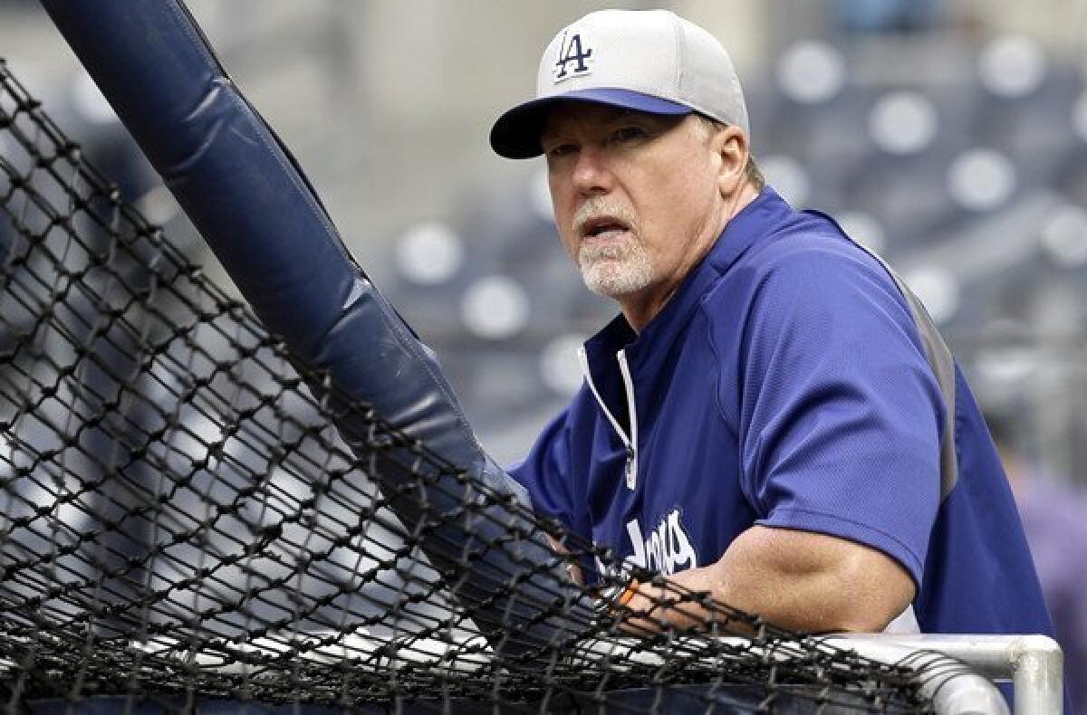 Hitting coach Mark McGwire watches the Dodgers take batting practice before a game against the San Diego Padres at Petco Park earlier this season.