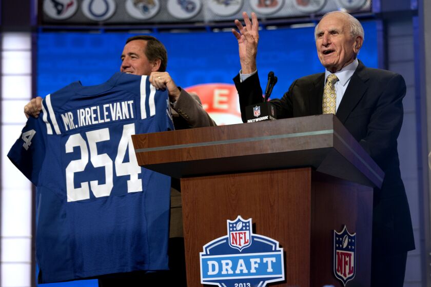 Former NFL receiver Paul Salata, right, announces the 254th overall pick of the NFL Draft, Saturday, April 27, 2013 at Radio City Music Hall in New York. South Carolina tight end Justice Cunningham was picked by the Indianapolis Colts to conclude the 2013 draft. (AP Photo/Craig Ruttle)