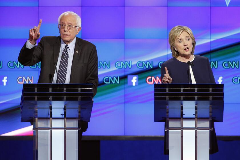 Hillary Clinton, right, and Sen. Bernie Sanders of Vermont at the Democratic presidential debate in Las Vegas.