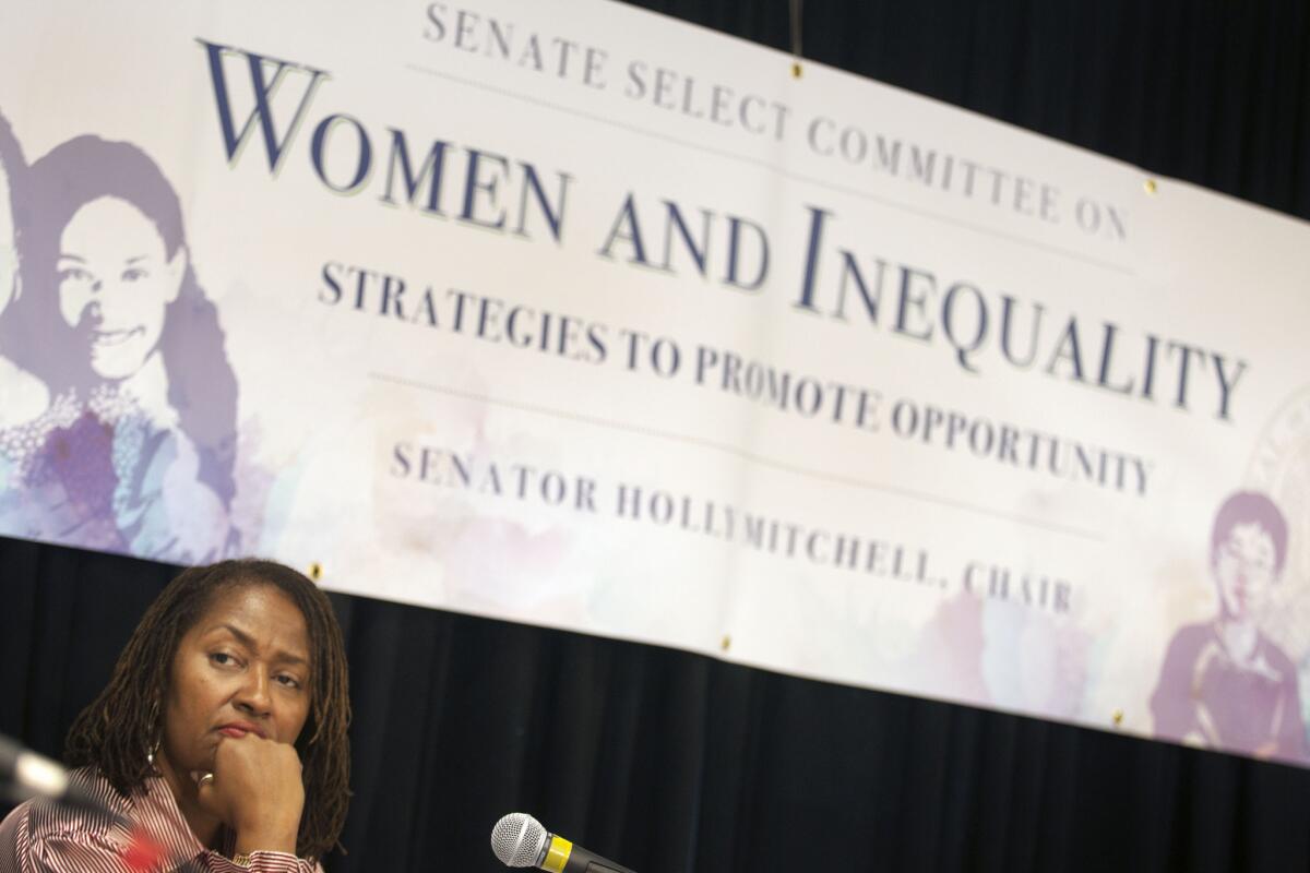 State Sen. Holly J. Mitchell listens to speakers during a hearing by the state and federal legislators on women and inequality on October 22, 2014. Mitchell's bill prohibiting the use of grand juries in cases of police-involved deaths passed the Senate on Thursday.