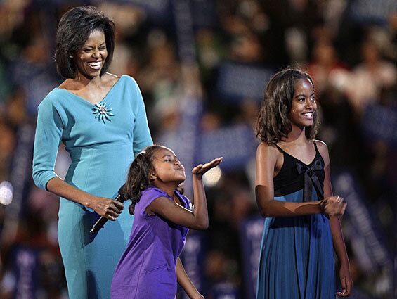 Michelle Obama in a Maria Pinto teal sheath dress ($795) and starburst brooch at the Democratic National Convention on Aug. 25, 2008.
