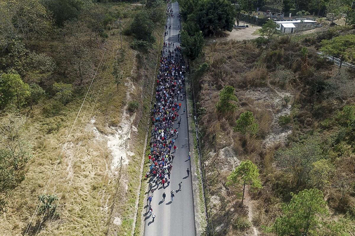 An aerial view of migrants walking along a highway near Agua Caliente, Guatemala, on Thursday.
