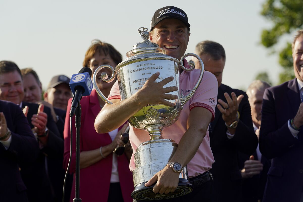 Justin Thomas holds the Wanamaker Trophy after winning the PGA Championship at Southern Hills Country Club on Sunday.