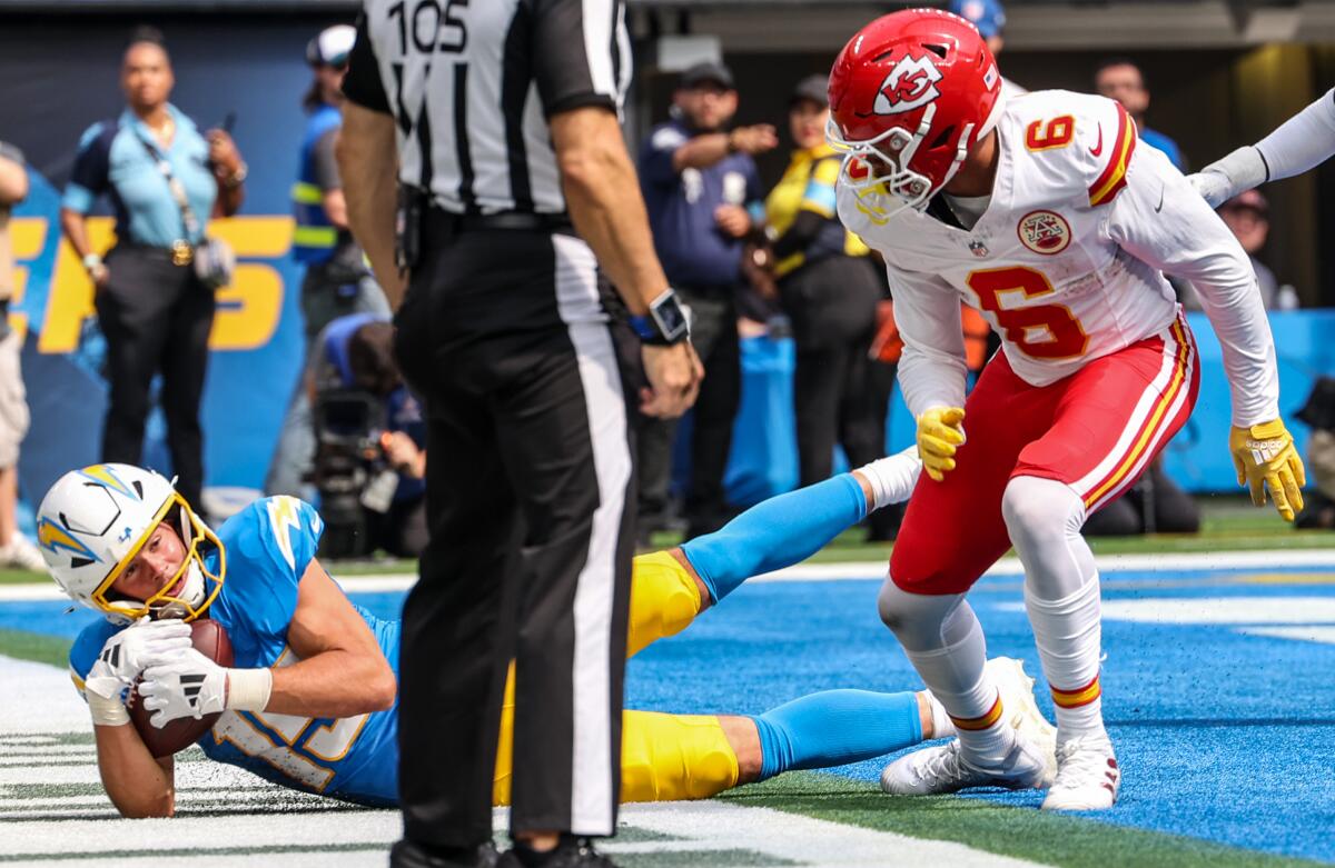 Chargers give Chiefs a scare earlier than Tremendous Bowl champs overcome 10-point deficit 1 Chargers receiver Ladd McConkey (15) hauls in a touchdown pass in the first half behind Chiefs safety Bryan Cook (6).