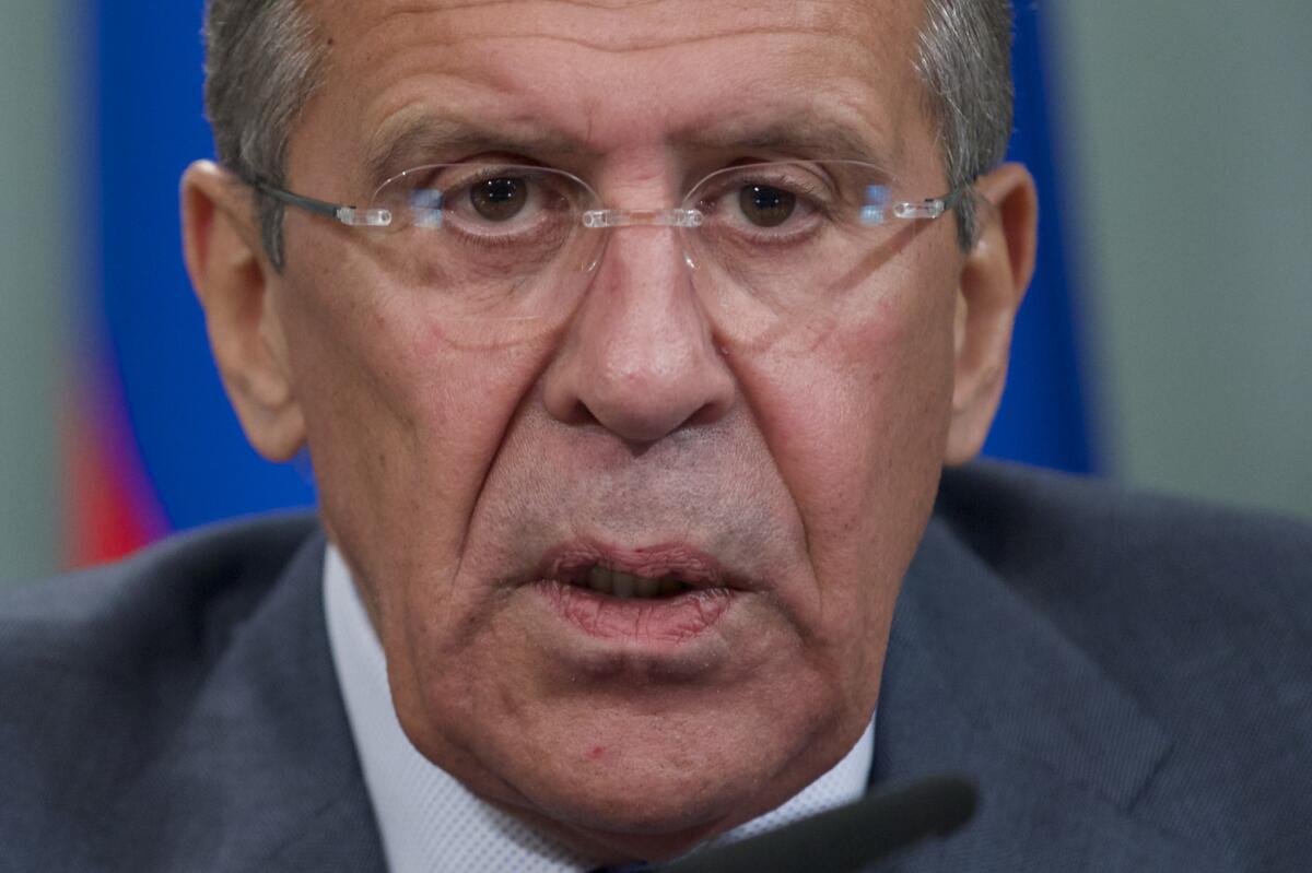 Russian Foreign Minister Sergei Lavrov holds a news conference after his meeting with French counterpart Laurent Fabius in Moscow.