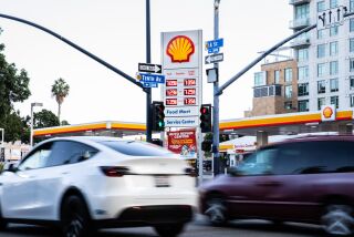 San Diego, CA - October 03: Cars zoom by the intersection of 11th Street and A Street in downtown in San Diego, CA on Monday, Oct. 3, 2022. Gas prices have climb over to $7 a gallon in San Diego. (Adriana Heldiz / The San Diego Union-Tribune)
