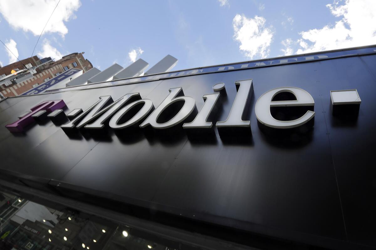 A sign above a T-Mobile store in New York is shown on Oct. 14, 2015. 