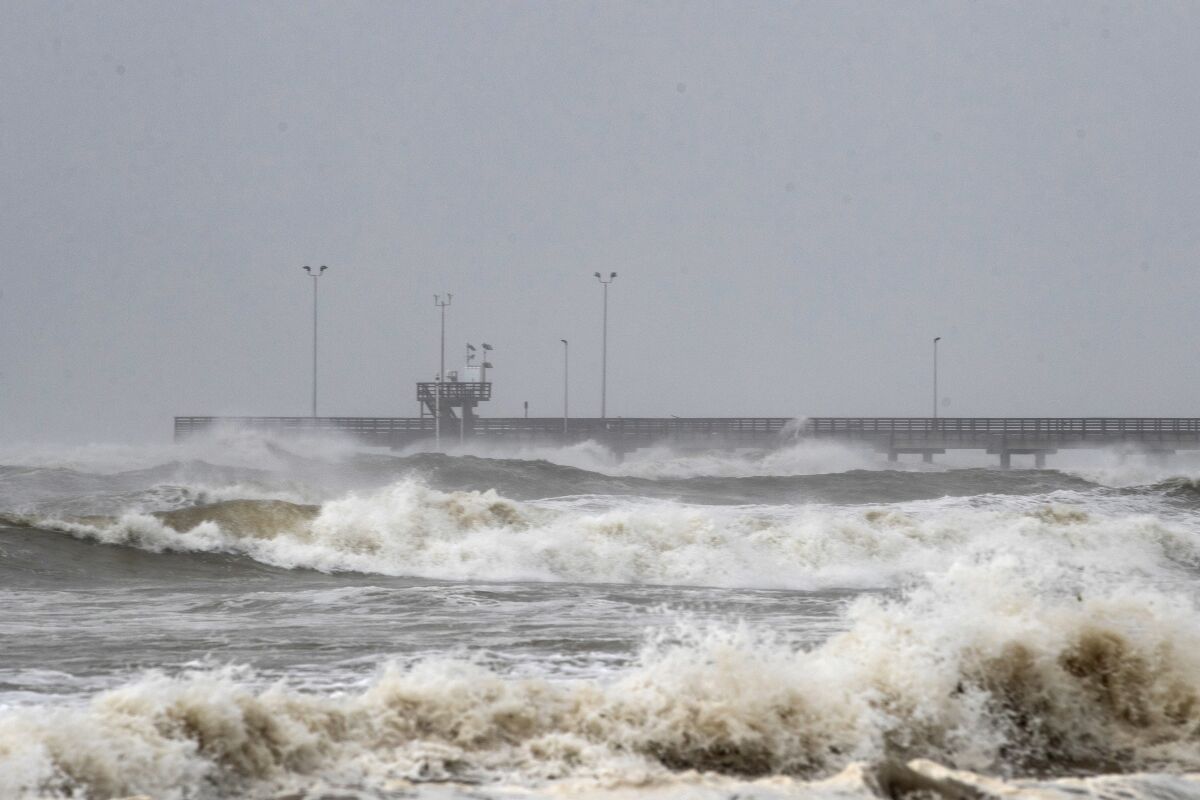 Rough waves crash around Bob Hall Pier in Corpus Christi, Texas, as Hurricane Hanna approaches land Saturday.