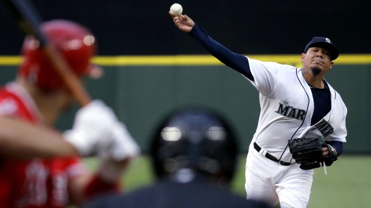 Mariners starter Felix Hernandez delivers a pitch against Angels slugger Albert Pujols in the fourth inning Thursday night in Anaheim.