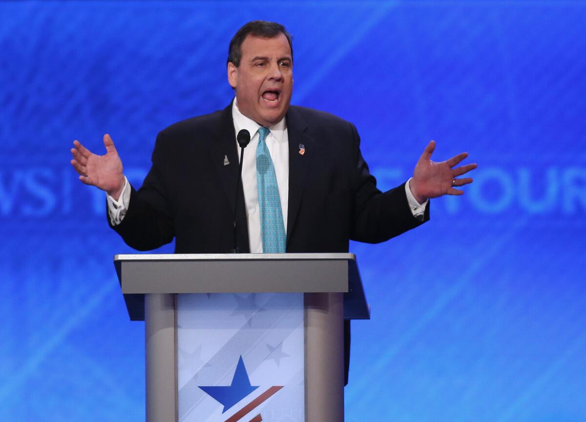 New Jersey Gov. Chris Christie speaks at the Republican presidential debate in Manchester, N.H. He suspended his campaign after finishing sixth in the New Hampshire primary.