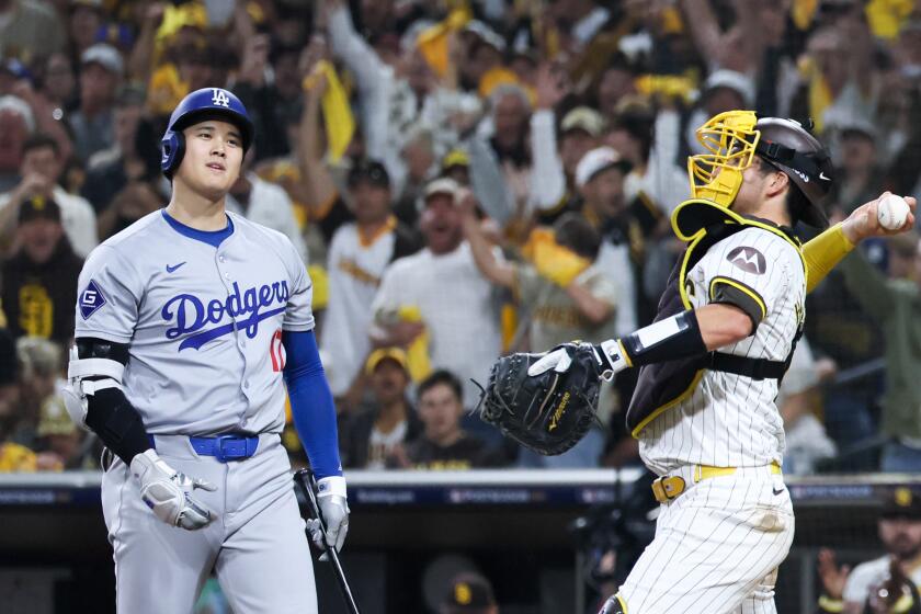 Dodgers star Shohei Ohtani reacts after striking out against the Padres in Game 3 of the NLDS.