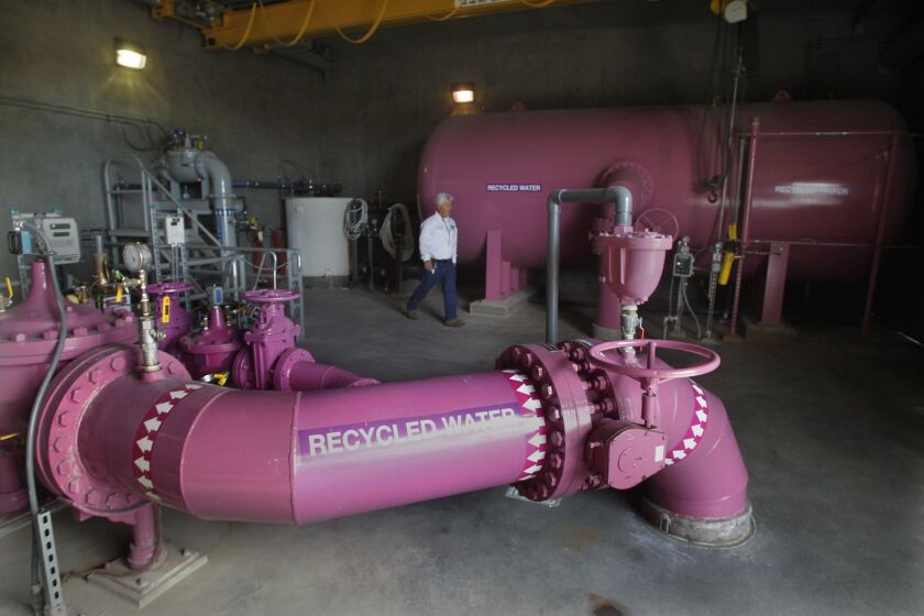 PURPLE POWER -- The distinctive purple color identifies the water from these pipes as recycled for non-potable use. File photo taken Nov. 22, 2013, at Otay Water District's 944 Pump Station at the 680 Reservoir in Chula Vista.