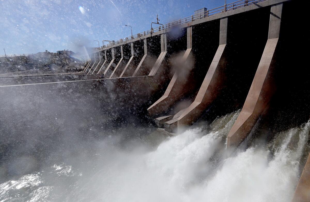 Water flows through a dam.