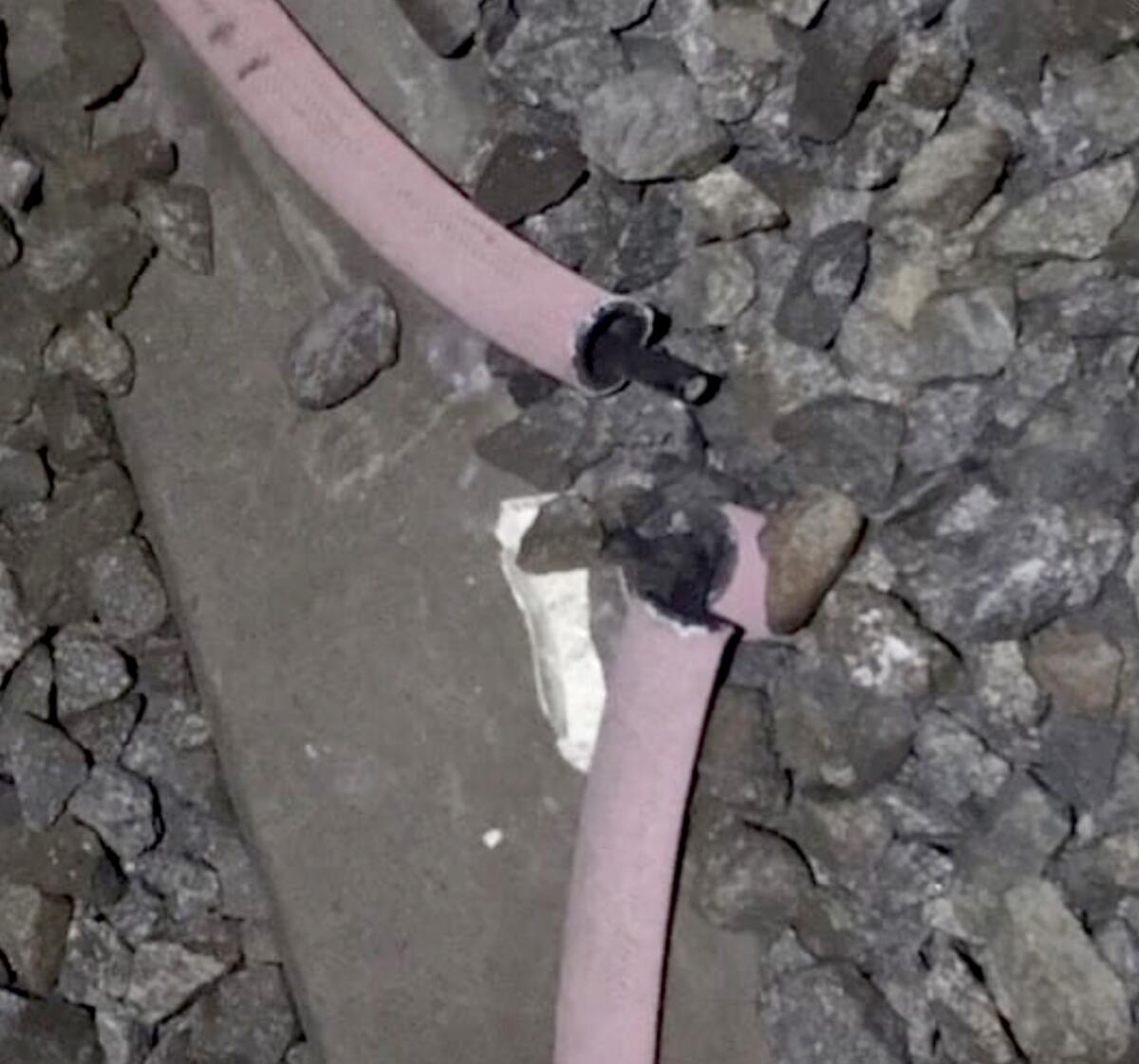 Wire sheathing left behind by copper thieves on a Metro train track