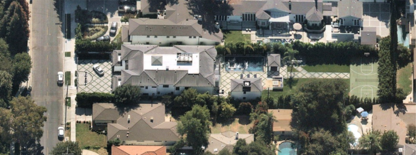 The property includes a main house, guesthouse, swimming pool and sports court.