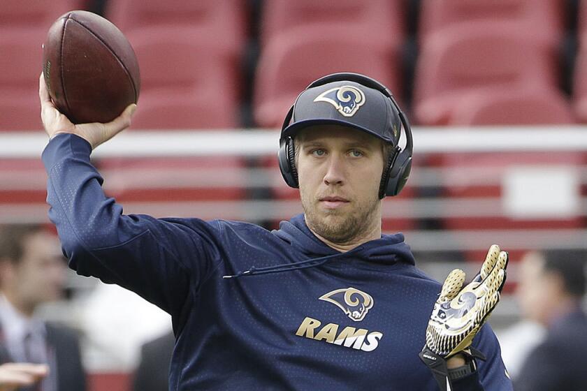 Nick Foles warms up with the Rams on Jan. 3.