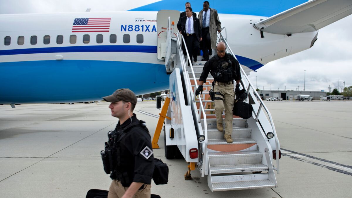 Members of the Secret Service protecting Hillary Clinton arrive at Philadelphia's airport on Sept. 19.