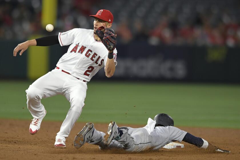 ANAHEIM, CA - APRIL 18: Dee Gordon #9 of the Seattle Mariners steals second base while Andrelton Simmons #2 of the Los Angeles Angels of Anaheim gets the throw late in the sixth inning at Angel Stadium of Anaheim on April 18, 2019 in Anaheim, California. (Photo by John McCoy/Getty Images) ** OUTS - ELSENT, FPG, CM - OUTS * NM, PH, VA if sourced by CT, LA or MoD **