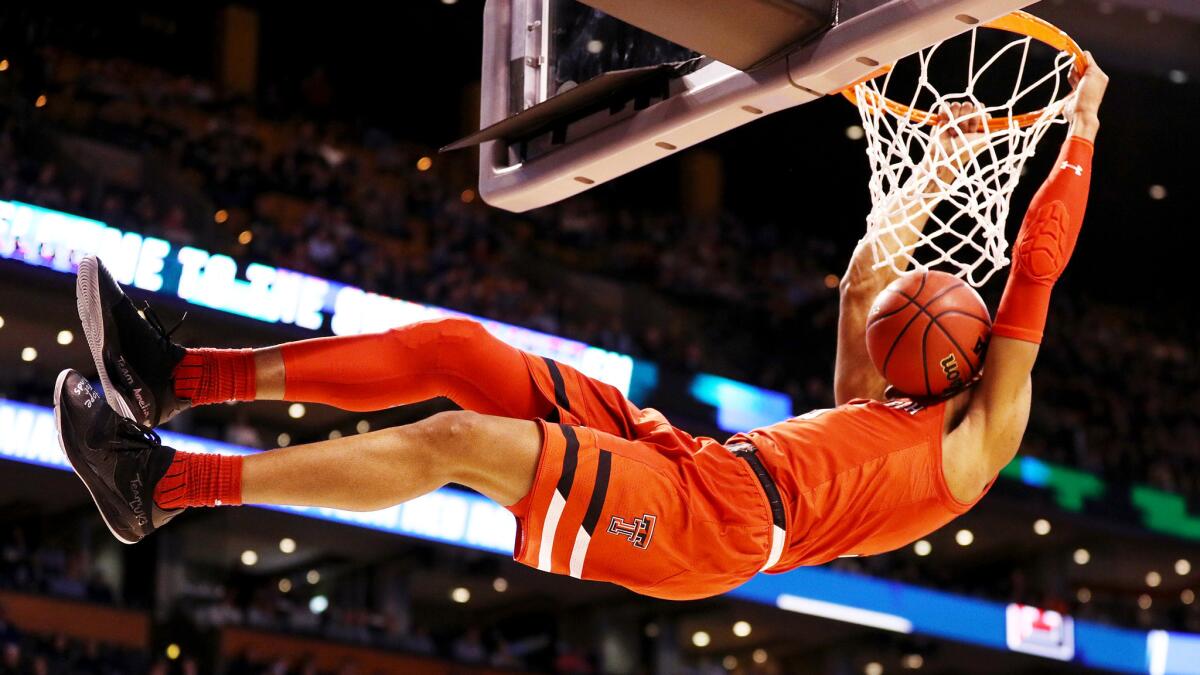 Texas Tech's Justin Gray finishes off a dunk against Purdue during their Sweet 16 game on Friday night in Boston.
