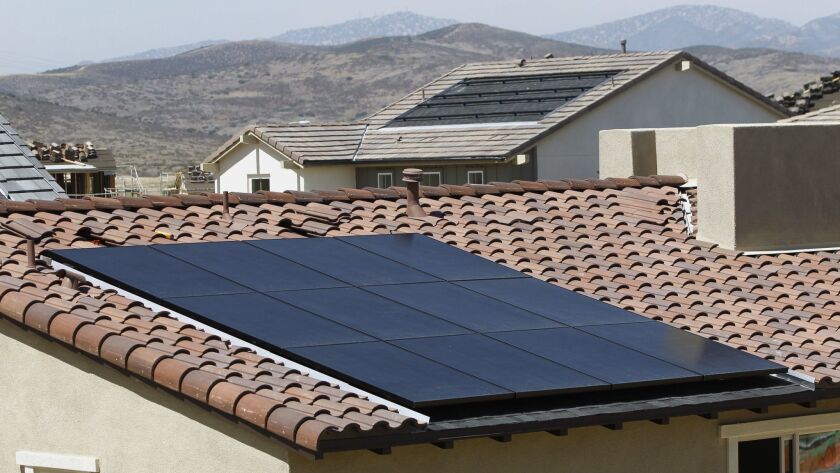 Solar panels on the roof of a new housing development in Santee.