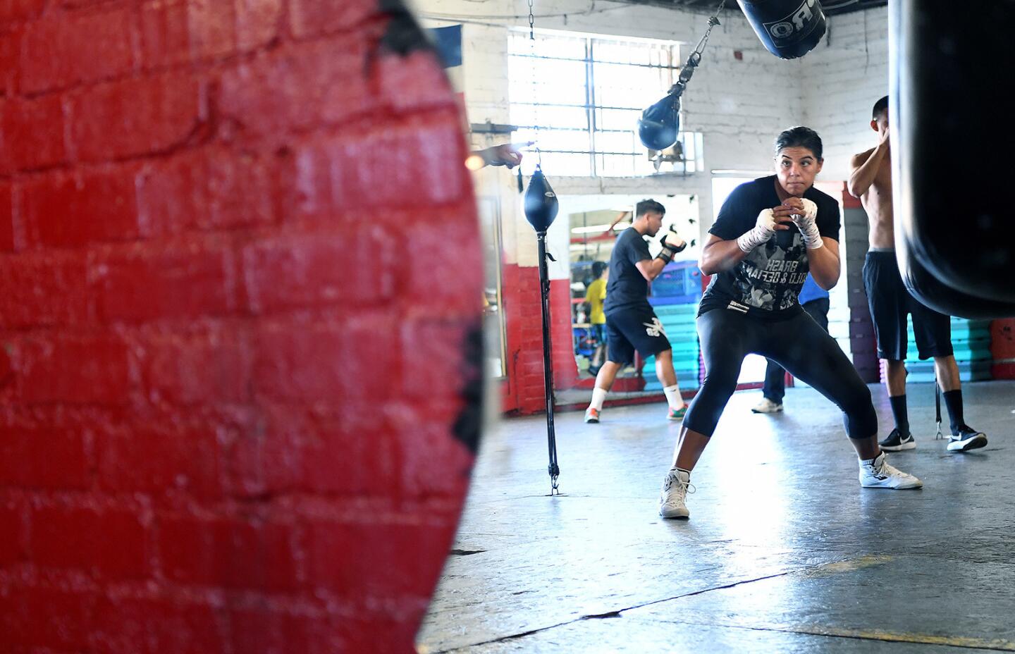 Middleweight boxer Maricela Cornejo trains for her fight in the co-main event of a Golden Boy Promotions card. Cornejo has overcome childhood and young adult adversity to emerge as a possible signature face of female boxing.