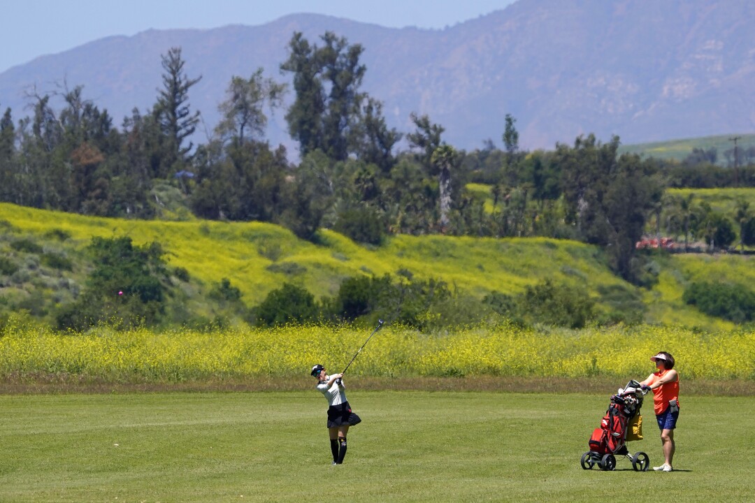 Golfers play a round at Rustic Canyon Golf Course