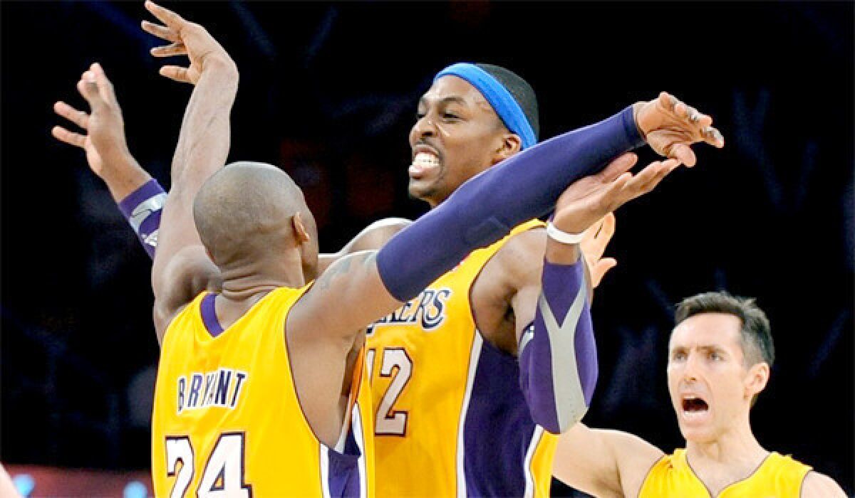 Kobe Bryant, Dwight Howard and Steve Nash celebrate during the Lakers' 102-84 victory over the Utah Jazz.