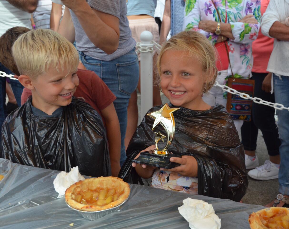 Scarlett Roose took first place in a children's apple pie eating contest during the Balboa Island Carnival & Taste of the Island on Sunday.