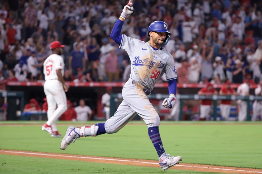 Anaheim, California September 3, 2024-Dodgers Mookie betts celebrates his three-run home run against the Angels in the tenth inning at Anaheim Stadium Tuesday. (Wally Skalij/Los Angeles Times)