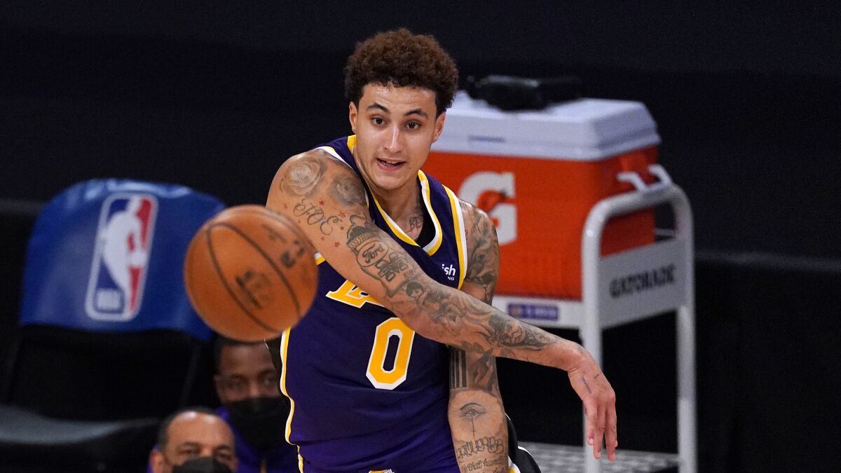 Lakers forward Kyle Kuzma passes the ball during the second half against the Memphis Grizzlies.