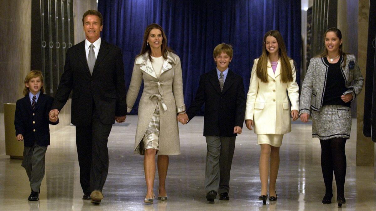Arnold Schwarzenegger, then recently elected governor of California, walks with his family towards the stage for the swearing-in ceremonies at the State Capitol building in Sacramento. Patrick appears to the right of his mother, Maria Shriver.