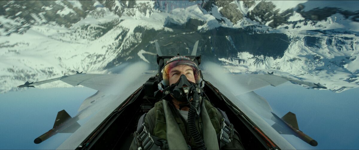 Tom Cruise plays Capt. Pete "Maverick" Mitchell in a jet in a scene in Top Gun: Maverick." 