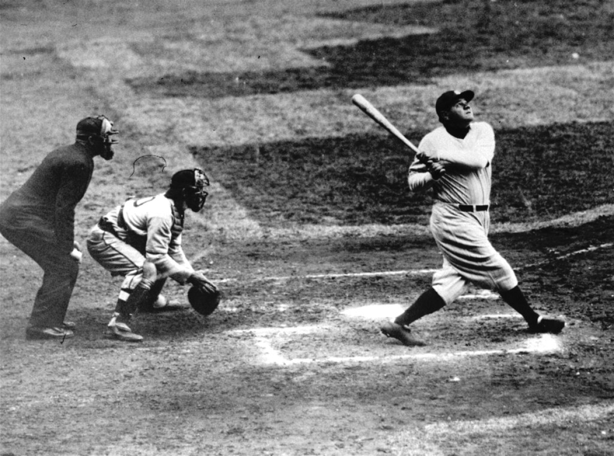 Babe Ruth of the New York Yankees clouts a towering home run