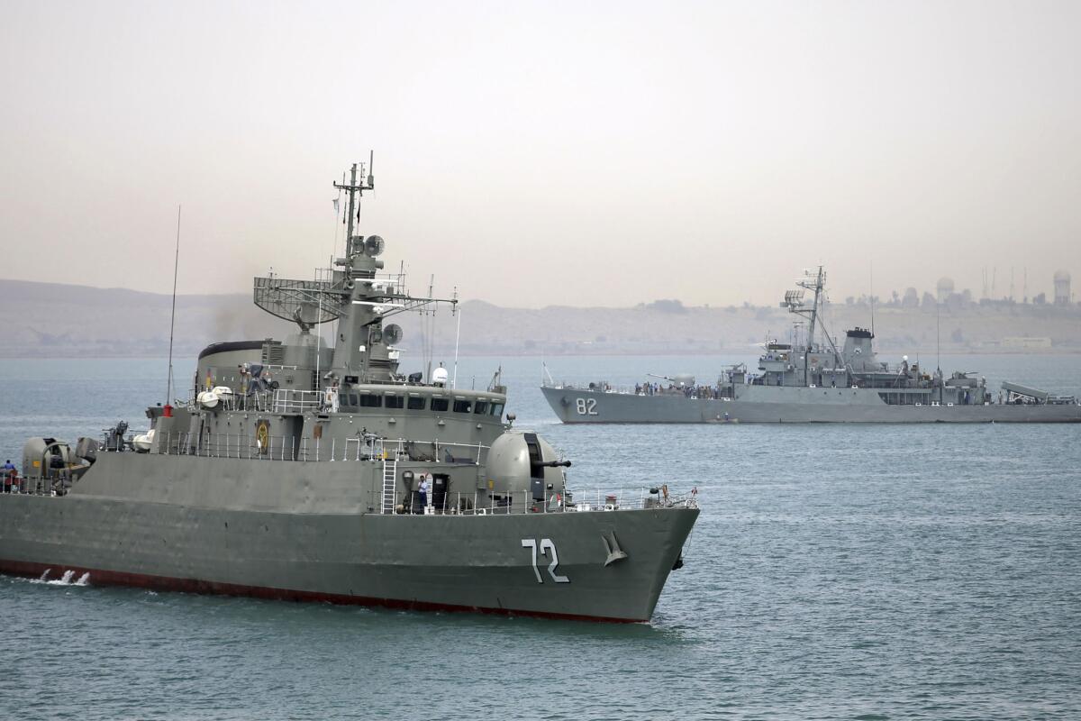 The Iranian warship Alborz, foreground, heads out on patrol in the Persian Gulf on April 7, one of several vessels dispatched by Tehran to the coast of Yemen where Saudi Arabia and Iran are backing rival factions in a civil conflict.