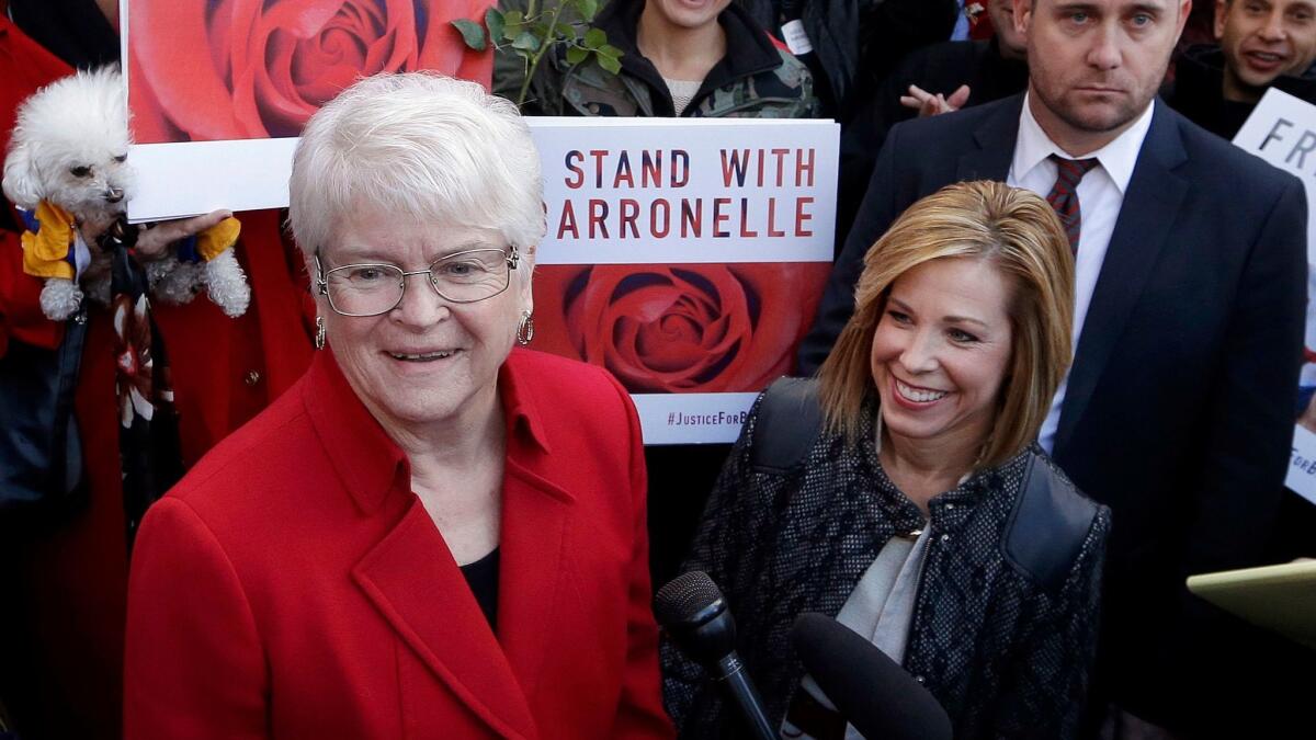 The Washington Supreme Court on Thursday unanimously ruled that florist Barronelle Stutzman, left, seen here in a 2016 photograph, broke the state's anti-discrimination law by refusing to provide services for a same-sex wedding.