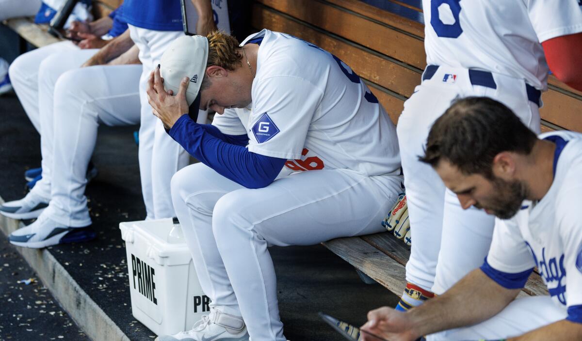 Dodgers pitcher Landon Knack sits in the dugout after giving up a two-run home run to Arizona's Christian Walker.