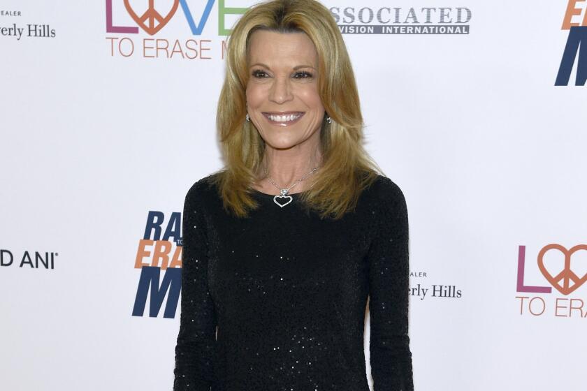 FILE - Game show personality Vanna White appears at the 25th annual Race to Erase MS Gala in Beverly Hills, Calif., on April 20, 2018. White will remain with "Wheel of Fortune'' for two additional seasons. (Photo by Chris Pizzello/Invision/AP, File)