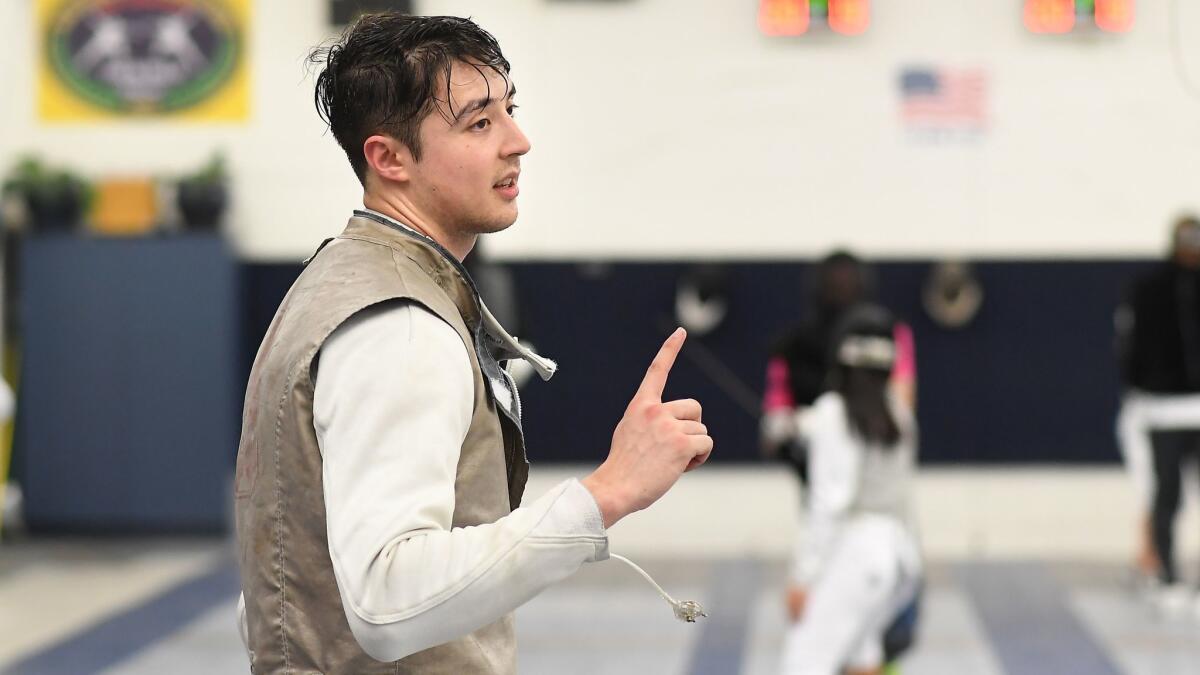 Alex Massialas takes a break during practice at Massialas Foundation Fencing Club in San Francisco.