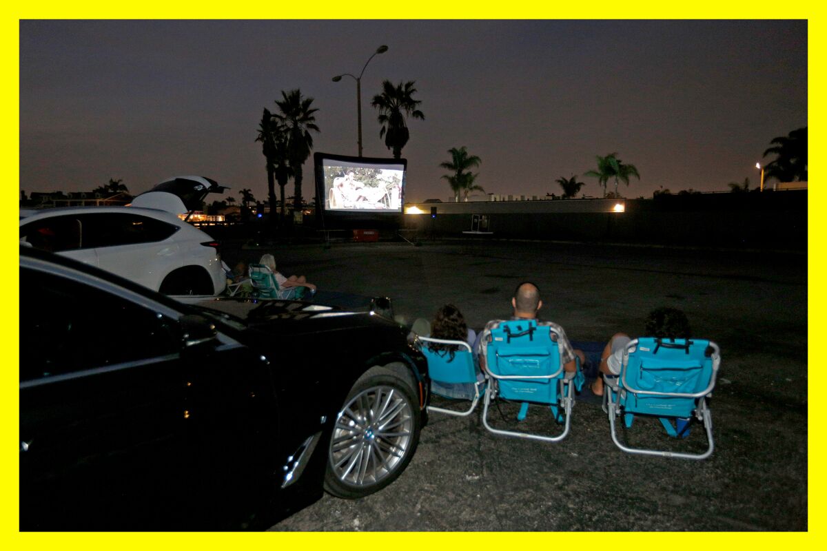 Moviegoers enjoy "Ferris Bueller's Day Off" at a temporary drive-in theater in Huntington Beach.