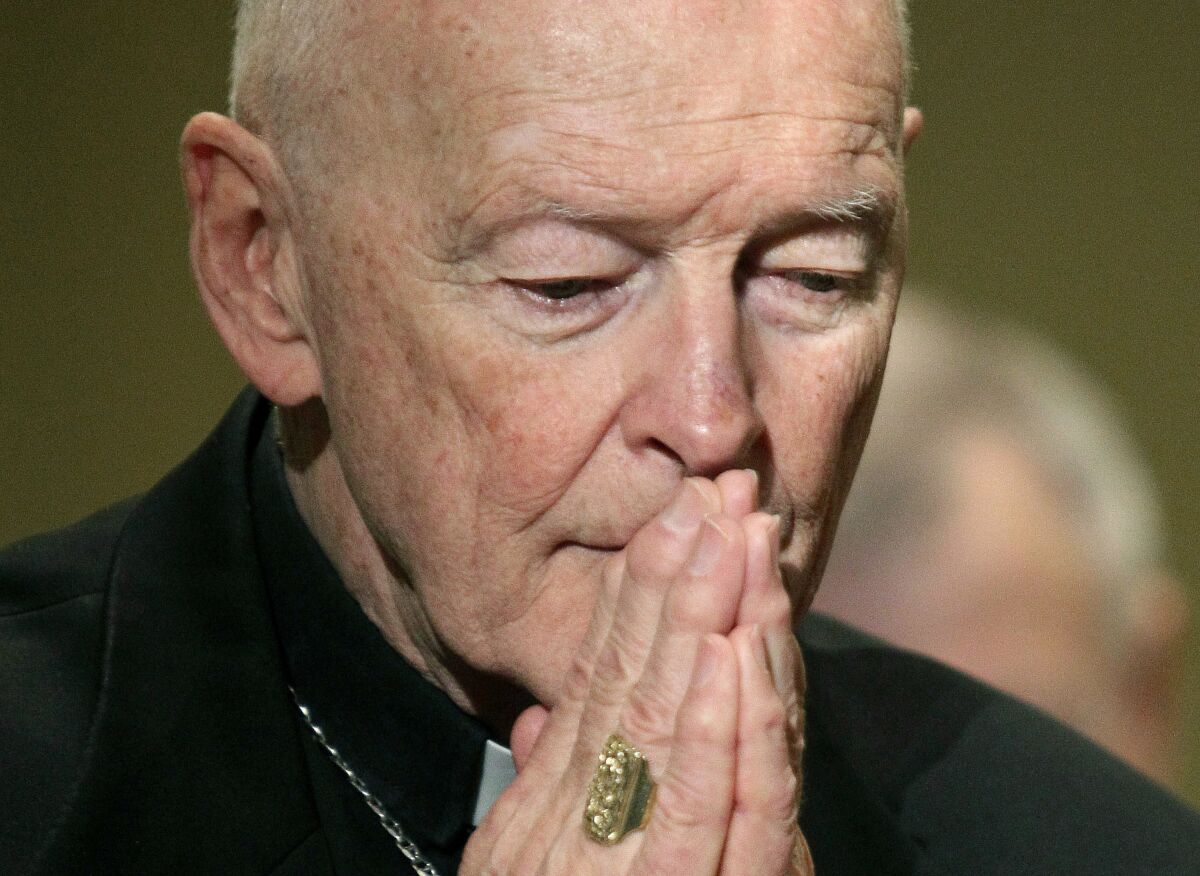 FILE - In this Nov. 14, 2011, file photo, then-Cardinal Theodore McCarrick prays during the United States Conference of Catholic Bishops' annual fall assembly in Baltimore. The Vatican on Tuesday will release its long-awaited report into what it knew about ex-Cardinal Theodore McCarrick’s sexual misconduct during his rise through the church hierarchy. The Vatican said Friday, Nov. 6, 2020 the report would span McCarrick’s entire life, from his birth in 1930 to the 2017 allegations that brought about his downfall. The Vatican said the report would cover “the Holy See’s institutional knowledge and decision-making process” as he rose through the church's ranks. (AP Photo/Patrick Semansky, File)