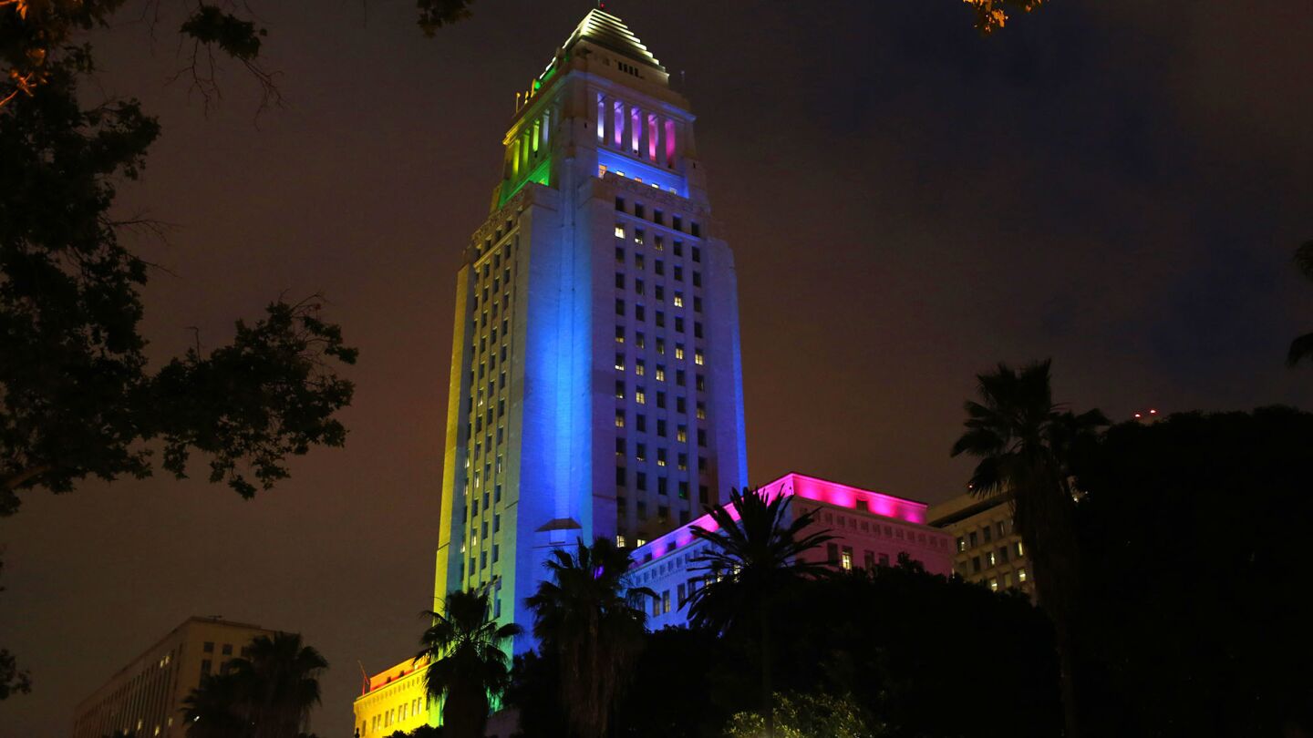 Los Angeles City Hall is lit up in colors of the rainbow during a candlelight vigil and rally, hosted by the Los Angeles LGBT Center.