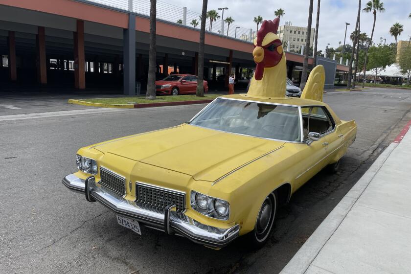 The El Gallo chicken car, parked in front of Hotville chicken at the Baldwin Hills Crenshaw mall.