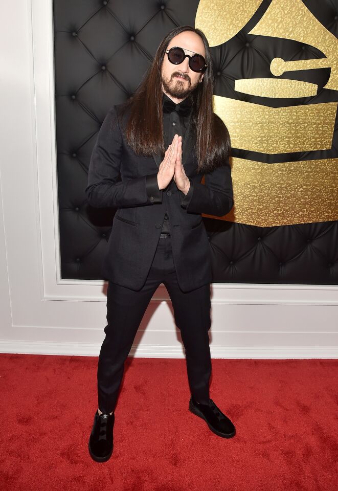 DJ Steve Aoki arrives at the 59th Grammy Awards.