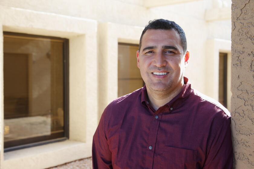 In this Aug. 11, 2020, photo Yasser Sanchez, a lifelong Republican, member of the Church of Jesus Christ of Latter-day Saints, and immigration attorney, is supporting Democratic presidential candidate Joe Biden, repelled by Republican President Donald Trump, shown here in Mesa, Ariz. (AP Photo/Ross D. Franklin, File)