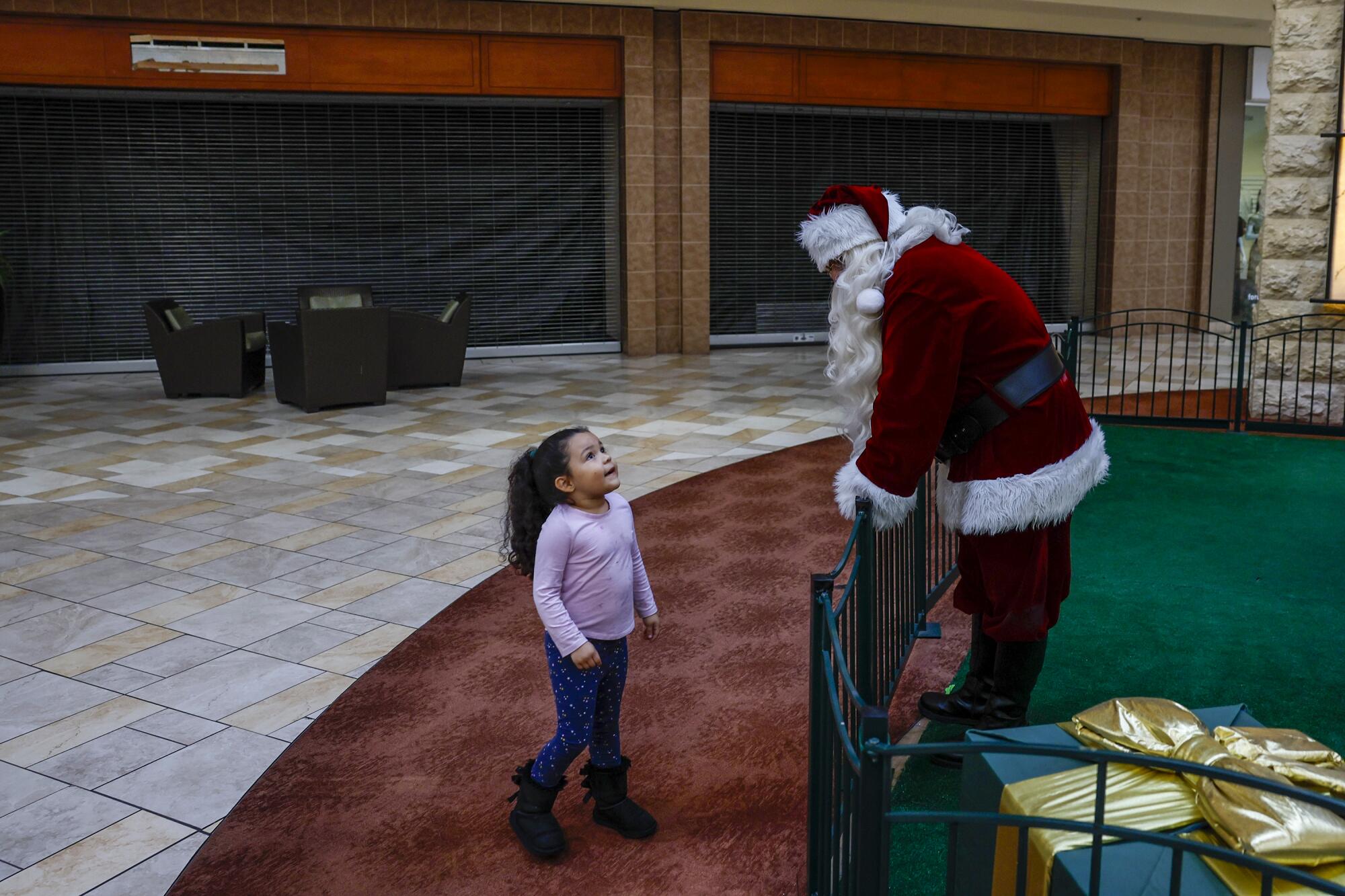 Niya Viera, 5, chats with Santa at the Puente Hills Mall.