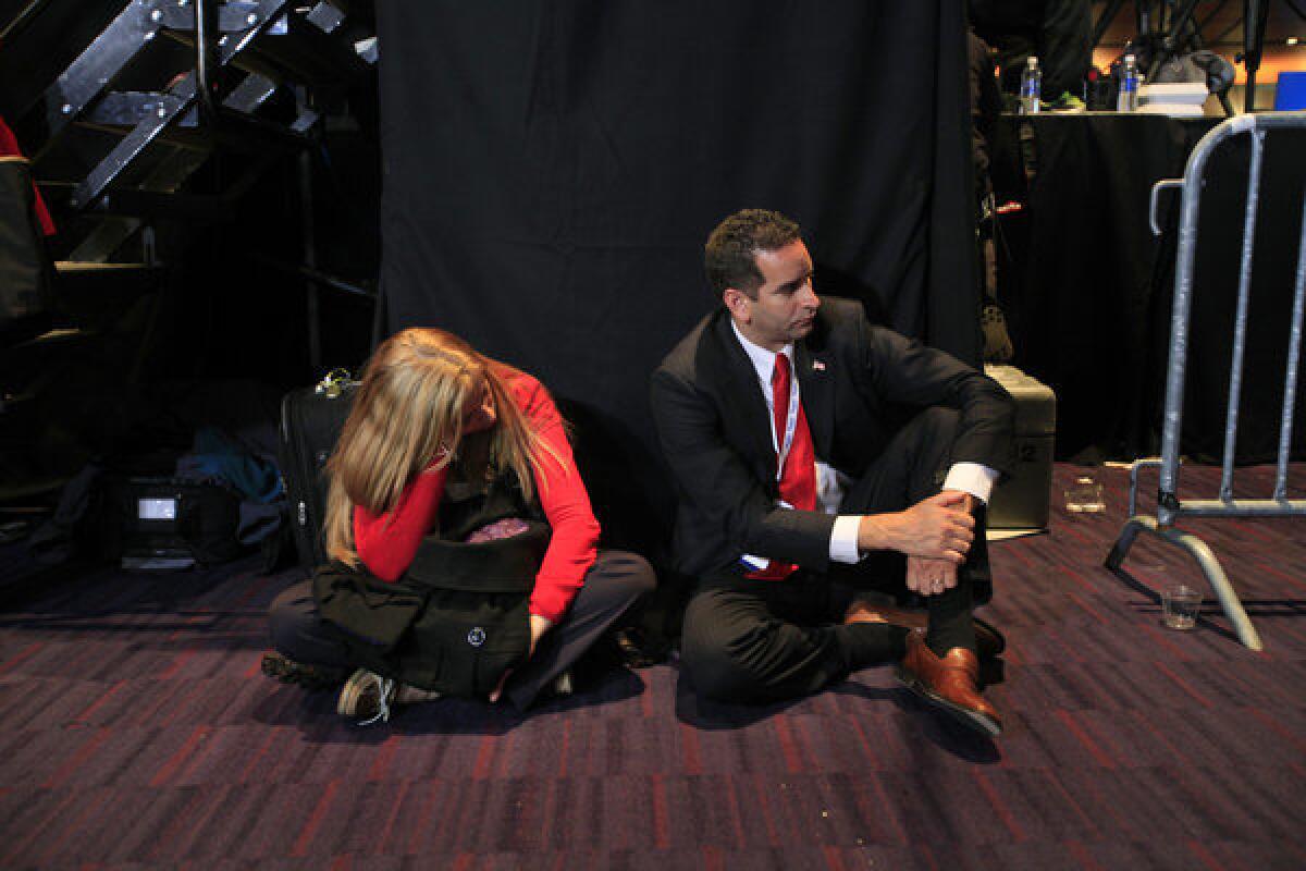 At the end of the night, supporters of Mitt Romney wait for him to come out and make a concession speech at the Boston Convention Center after the Republican nominee lost the election to President Obama.