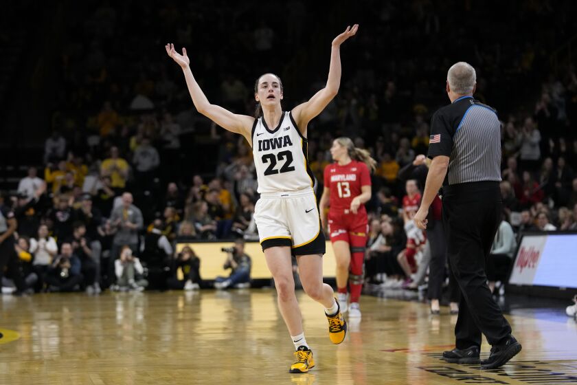 Iowa guard Caitlin Clark celebrates during the first half of an NCAA college basketball game against Maryland, Thursday, Feb. 2, 2023, in Iowa City, Iowa. (AP Photo/Charlie Neibergall)